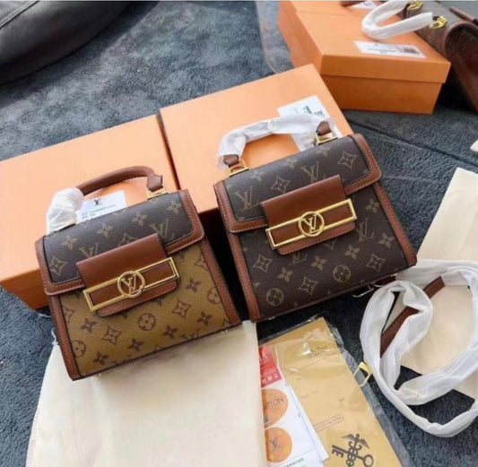 Louis Vuitton Reisse Handbag