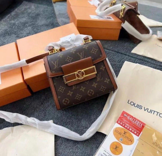 Louis Vuitton Reisse Handbag